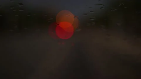 Rain seen through a car window at night with nice bokeh Stock Footage 164609344