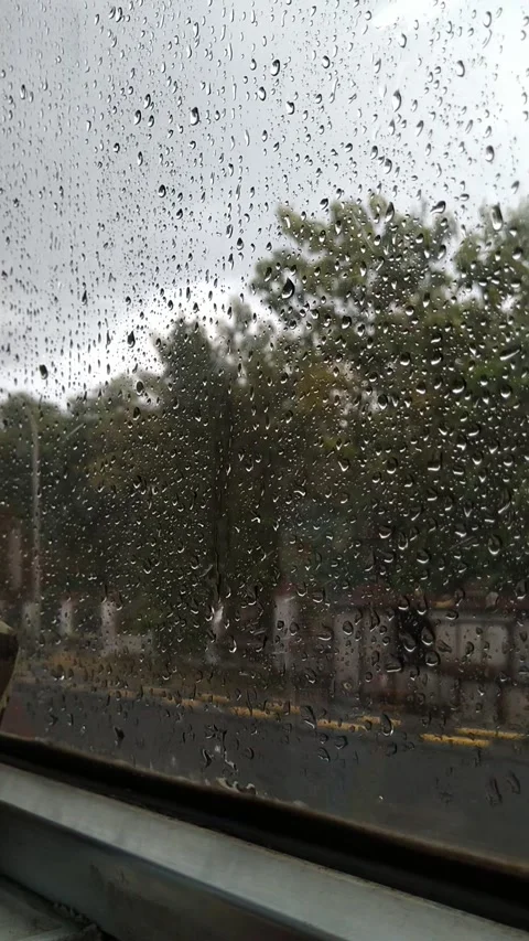 Rain seen through the glass window Stock Footage 307789936