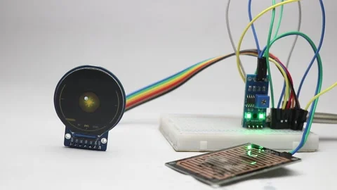 Rain sensor module activating as water droplets fall on the sensor plate Video stock 345885492
