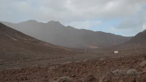 Rain shower moving across mountain valley with dramatic clouds timelapse 스톡 동영상 331162554