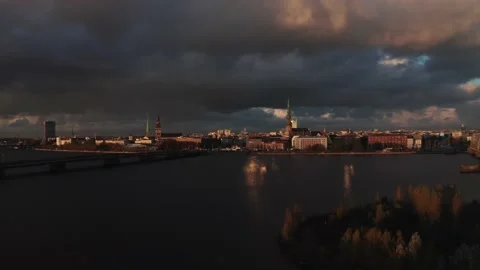 Rain shower over Riga, Latvia at sunset. Aerial view of the Riga old town 스톡 동영상 141452227