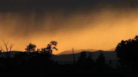 Rain shower at sunset Stock Footage 60794138