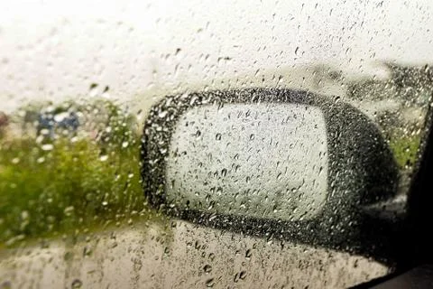 Rain on the side window of the car, selective focus Stock Photos