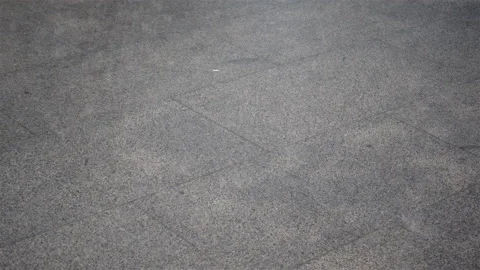 Rain on the sidewalk and running legs in 4K. Stock Footage 127712965
