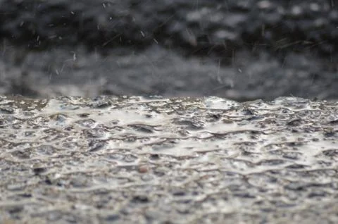 Rain on Sidewalk Stock Photos
