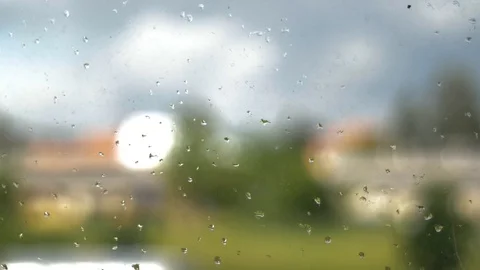 Rain sitting on a window in a rainy day Stock Footage 112282092