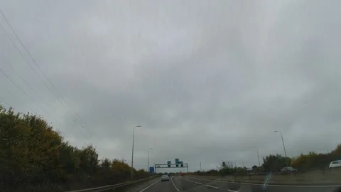 Rain Sky and Dramatic Black Clouds over England During Drive Stock Footage 320112693
