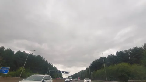 Rain Sky and Dramatic Black Clouds over England During Drive Stock Footage 321027109