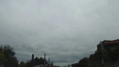 Rain Sky and Dramatic Black Clouds over England During Drive Stock Footage 321158431
