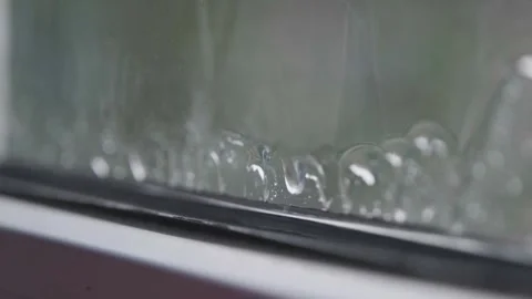 Rain in slow motion. Raindrops falling in slow motion. Raindrops close-up Stock Footage 262534427