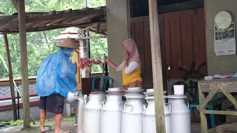 Rain-Soaked Dairy Farm in Merapi Highlands Stock-Footage 323548872