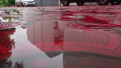 Rain-soaked-red-pavement-puddles-static-closeup 5 Stock Footage 345109836