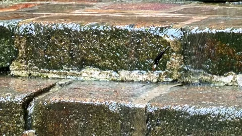 Rain-Soaked Stone Steps Highlighting Weathered Texture Stock Footage 334156990