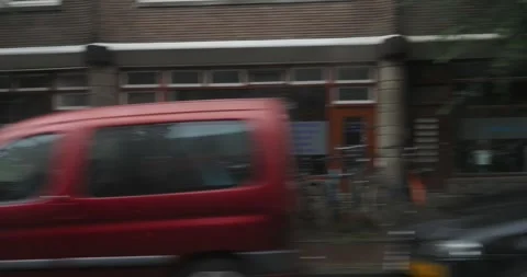 Rain soaked streets of Amsterdam capturing the essence of a wet day Stock-Footage 300617524