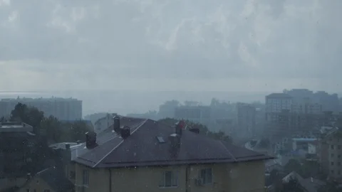Rain in Sochi against the backdrop of the sea. time is closer to sunset. raindro Stock Footage 115543408