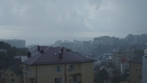 Rain in Sochi against the backdrop of the sea. time is closer to sunset. raindro Stock Footage 115543425
