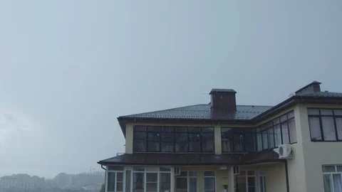 Rain in Sochi against the backdrop of the sea. time is closer to sunset. raindro Stock Footage 115543448