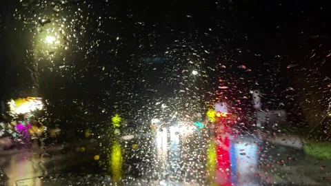 Rain-Speckled Windshield View on a Colorful Rainy Night in California Stock Footage 271095824
