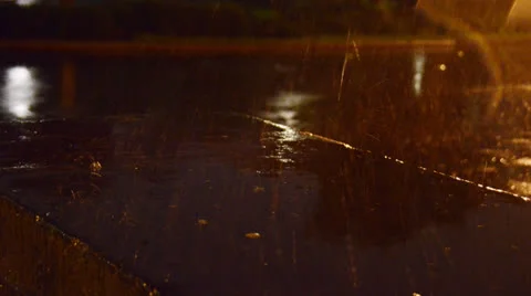 Rain splash at night Stockbeeldmateriaal 25797838
