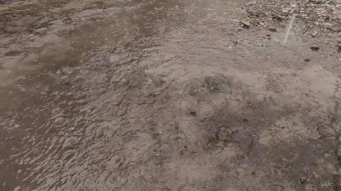 Rain Splashing on Ground with Strong Droplets Stock Footage 332898328
