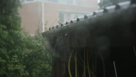 Rain splashing out of the gutter Stock Footage 11402788