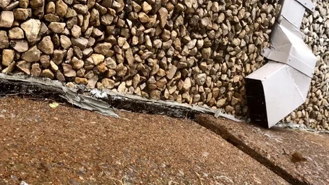 Rain Splashing in Storm Drain Stockbeeldmateriaal 79330136