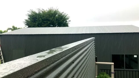Rain splashing on top of tin wall Stock Footage 162997199