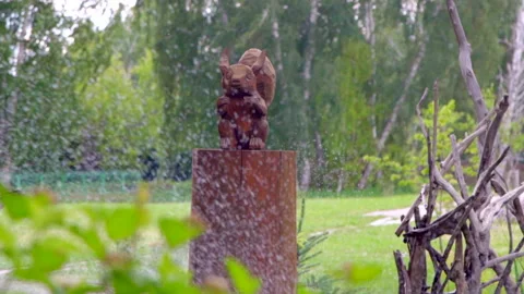 Rain in a spruce forest with a Christmas tree with a wooden figurine Stock Footage 207951667