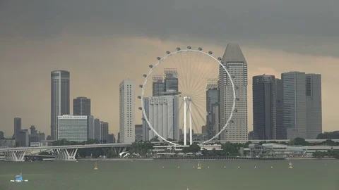 Rain storm develops over The Flyer ferris wheel in Singapore 스톡 동영상 78458241