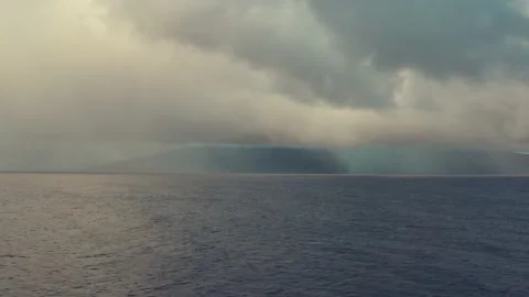 RAIN STORM OVER OCEAN PACIFIC MAUI HAWAII DRONE Stock Footage 227229965