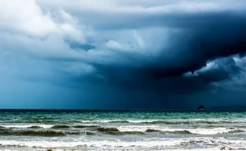 Rain storm over the ocean Stock Photos