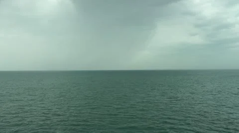Rain storm over the sea from the deck of a ship underway 動画素材 12410156