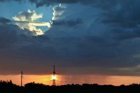 Rain at sunset. Dark clouds, heavy rain at sunset. Weather and nature concept Stock-Fotos
