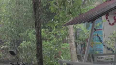 Rain on the swing of the children's playground Stock Footage 185366393