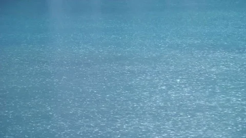 The Rain Tapping on the Water's Surface Stock Footage 332378216