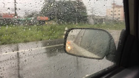 Rain through car window Stock Footage 100807544