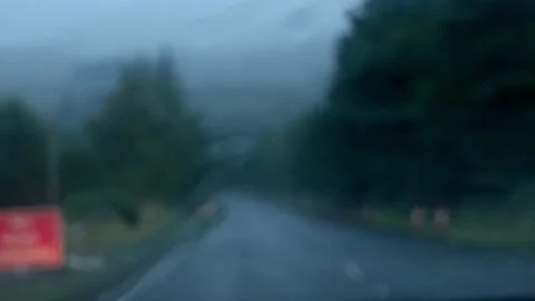 Rain through a car with a windscreen on a dark road Stock Footage 219504244