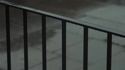 Rain through railings - close up Stock Footage 93208227