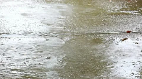 Rain from a thunderstorm is hitting the sidewalk Stock-Footage 11077900