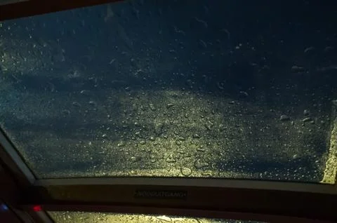Rain on top of a window Stock Photos