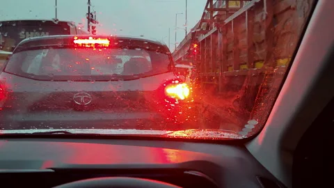 Rain traffic jam in India with red brake lights and truck close up Stock-Footage 345021694