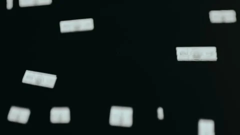 Rain of US dollar banknotes on a dark background Stock Footage 332462690