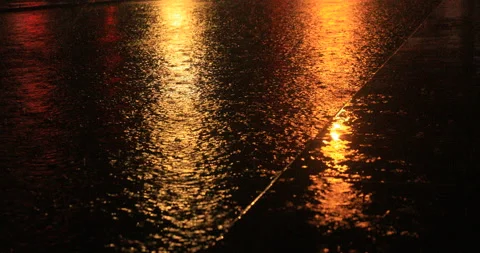 Rain vehicles under warm lights Stock Footage 198518140