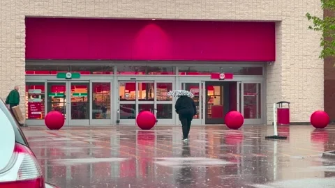 Rain - Walking Into a Retail Store - Umbrella - Davenport, IA - April 27, 2026 Stock Footage 333600192