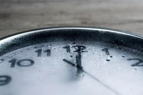 Rain on wall clock Stock Photos