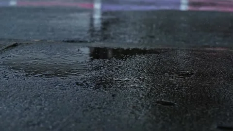 The rain was falling on the cement floor in slow motion, splashing like water Stock-Footage 188427270