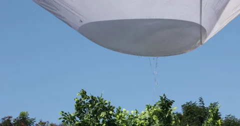 Rain water on cloth Stock Footage 324398375