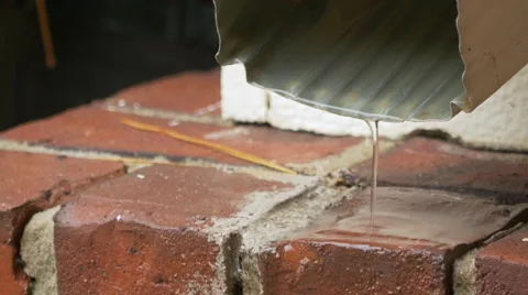 Rain water coming down a spout from a residential house Stock Footage 56293350
