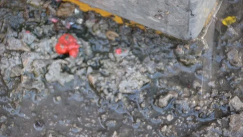 Rain water dripping from the drain. Rain water coming out of roof gutter drainag Stock Footage 170151703