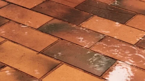 Rain water dripping on old floor tiles. 库存影片 84224161